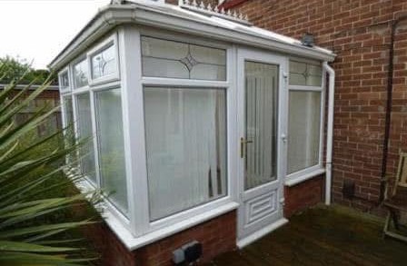 The uPVC conservatory at the back of the house before the work began