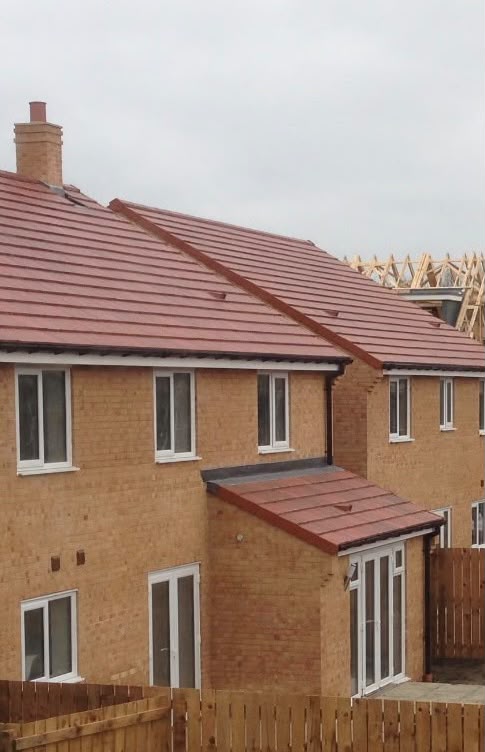 The house as originally built, with neighbouring homes on the estate still under construction