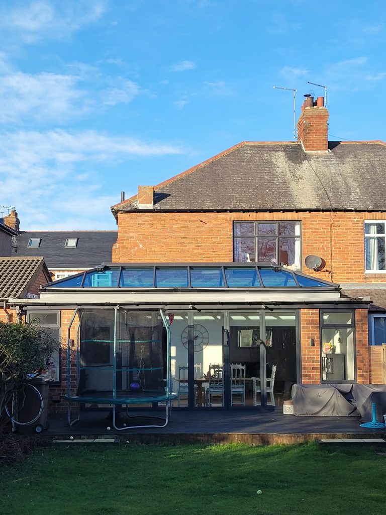 Rear of the 1930s semi before the loft conversion, showing the original roof above the rear extension